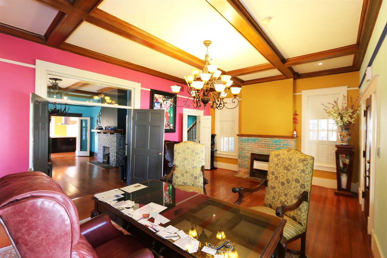 1619 Matamoros Street Laredo, TX 78040 - Photo 4 of 20 a dining room with furniture a chandelier and wooden floor