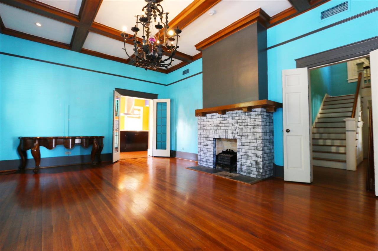 1619 Matamoros Street Laredo, TX 78040 - Photo 5 of 20 a view of a livingroom with fireplace wooden floor and windows