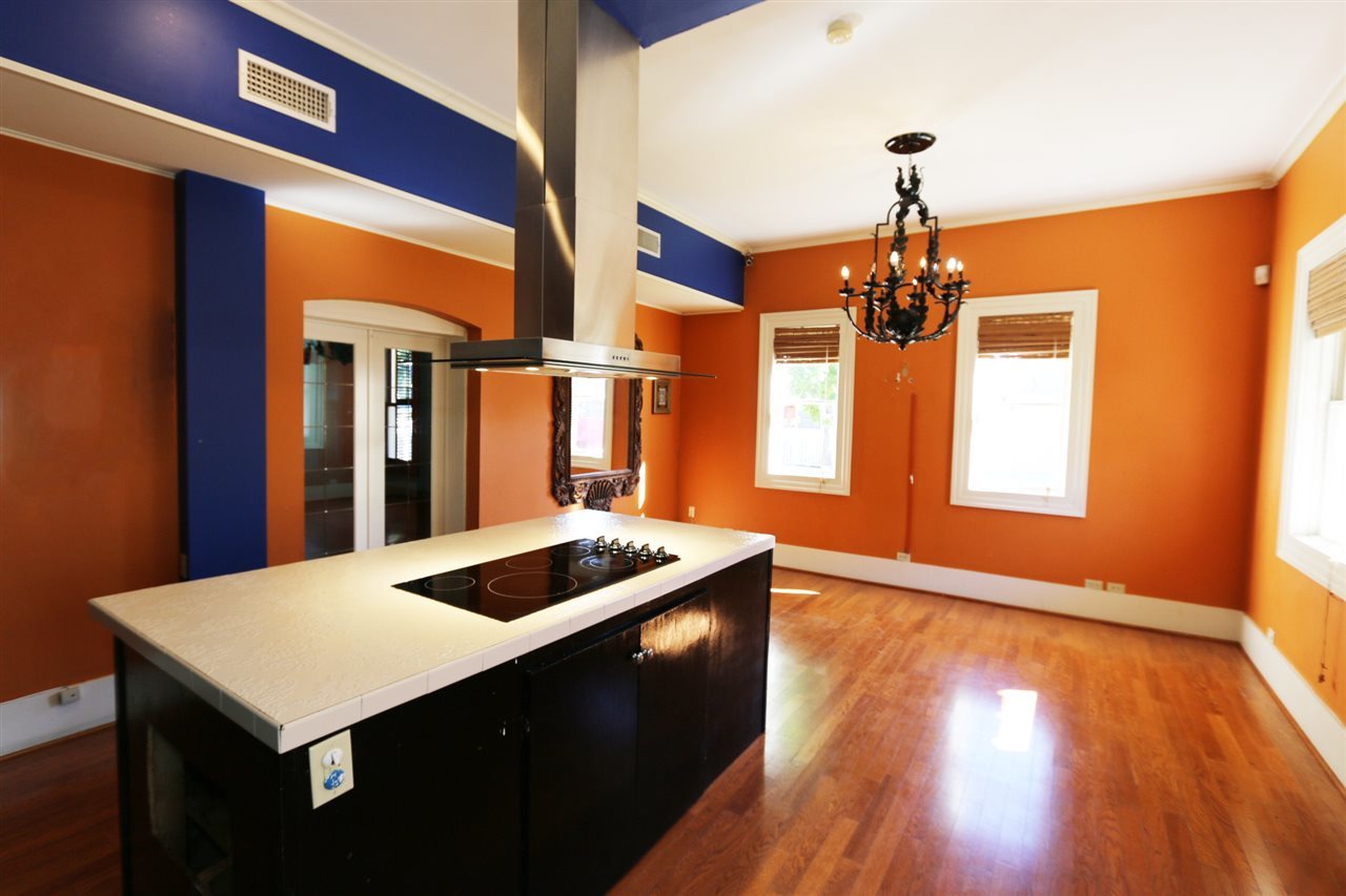 1619 Matamoros Street Laredo, TX 78040 - Photo 7 of 20 a kitchen that has a table chairs and wooden floor