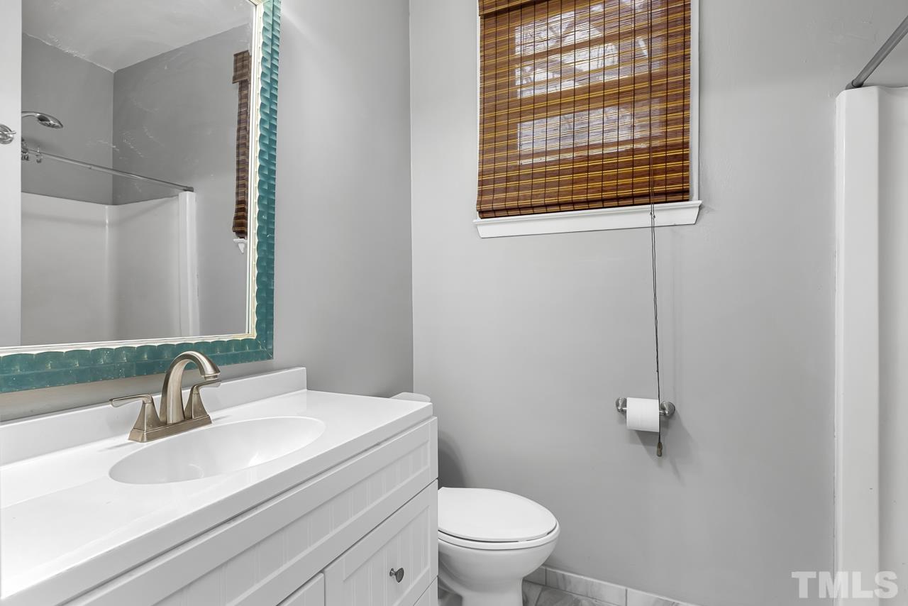 1314 Dowling Road Raleigh, NC 27610 - Photo 15 of 34 a bathroom with a sink and a toilet