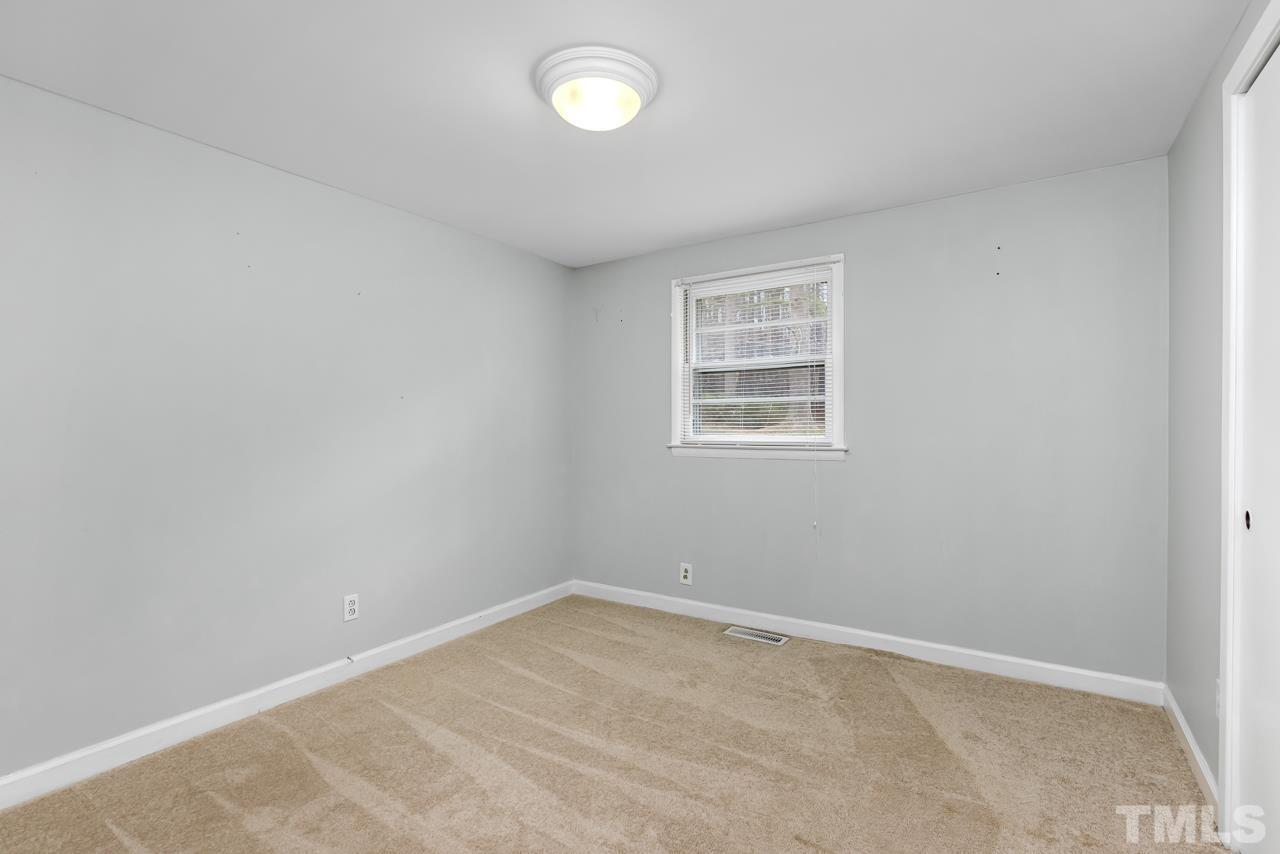 1314 Dowling Road Raleigh, NC 27610 - Photo 16 of 34 an empty room with a window