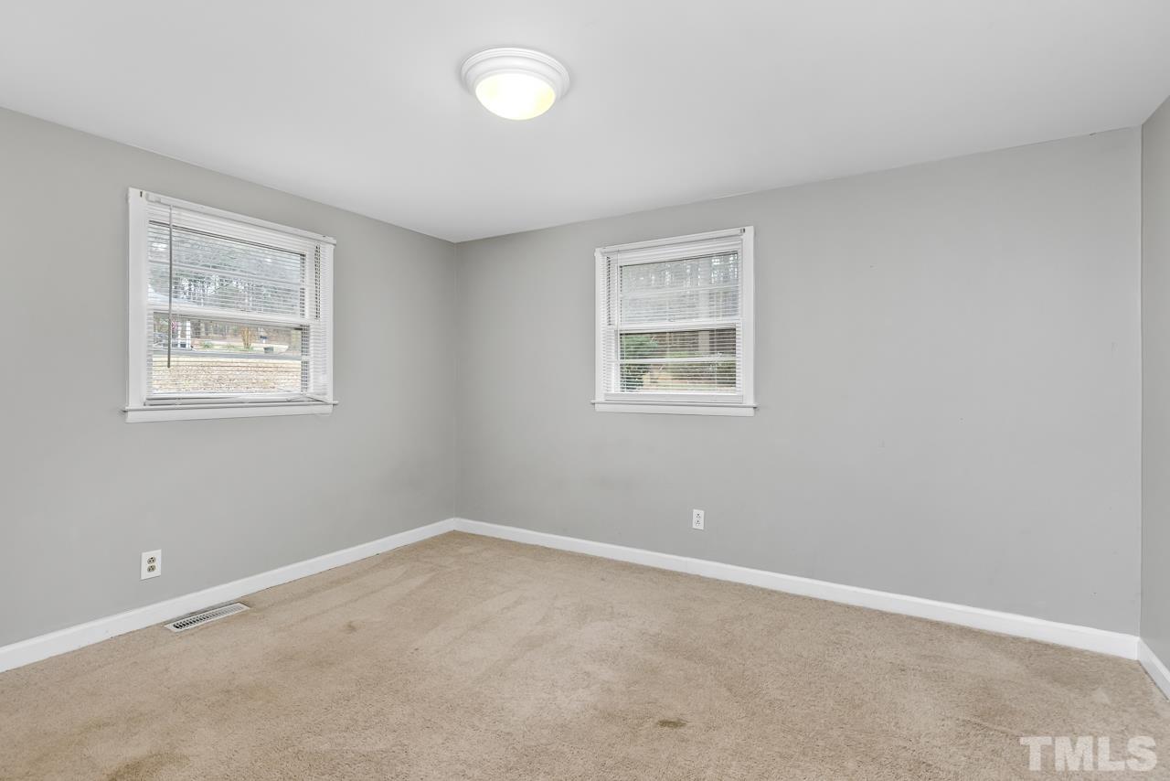1314 Dowling Road Raleigh, NC 27610 - Photo 17 of 34 an empty room with windows