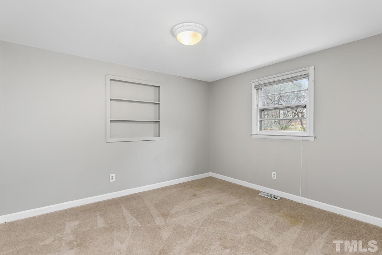 1314 Dowling Road Raleigh, NC 27610 - Photo 18 of 34 an empty room with a window