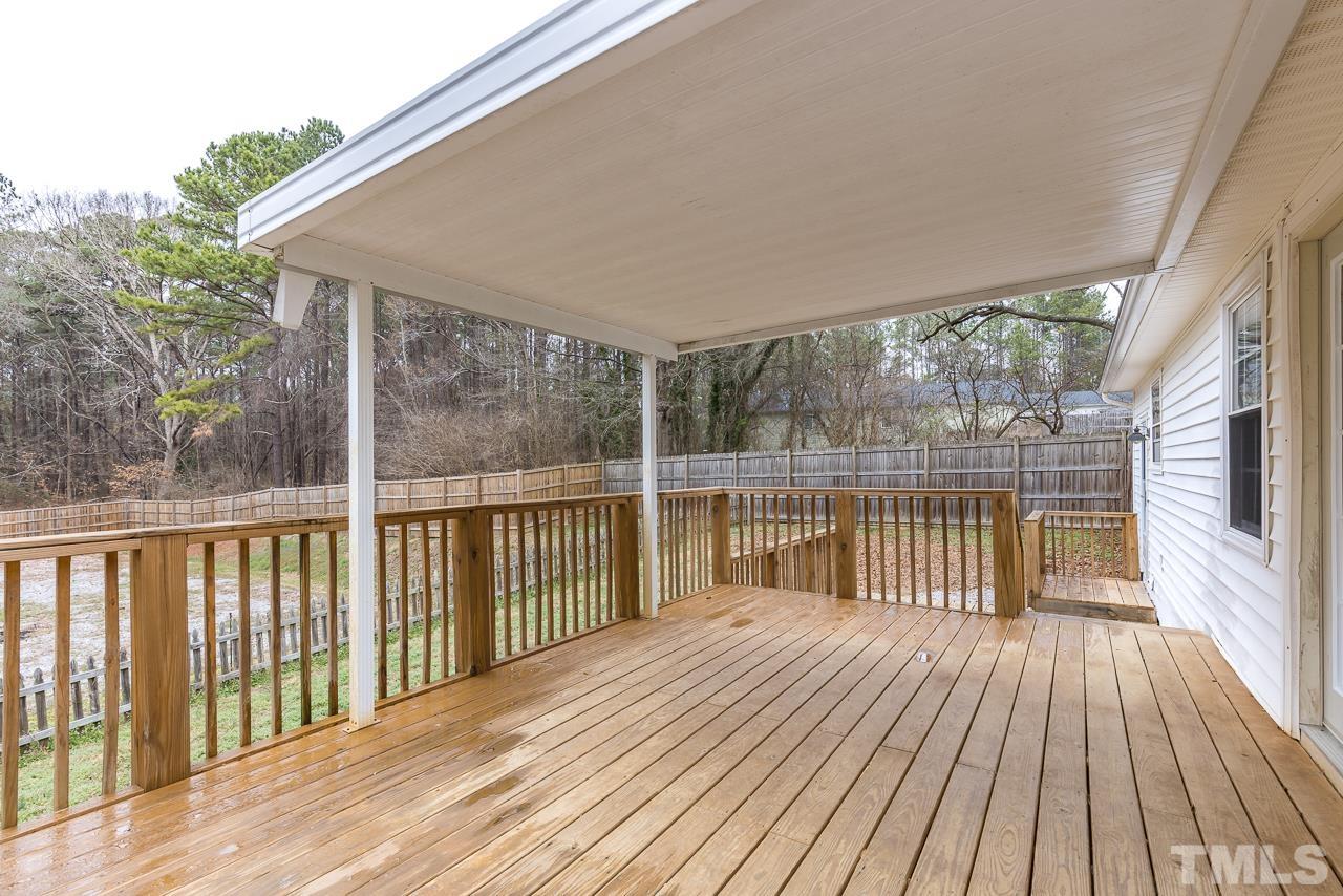 1314 Dowling Road Raleigh, NC 27610 - Photo 20 of 34 a balcony with wooden floor