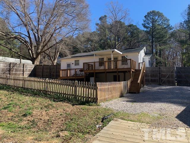 1314 Dowling Road Raleigh, NC 27610 - Photo 2 of 34 a view of a house with a wooden fence