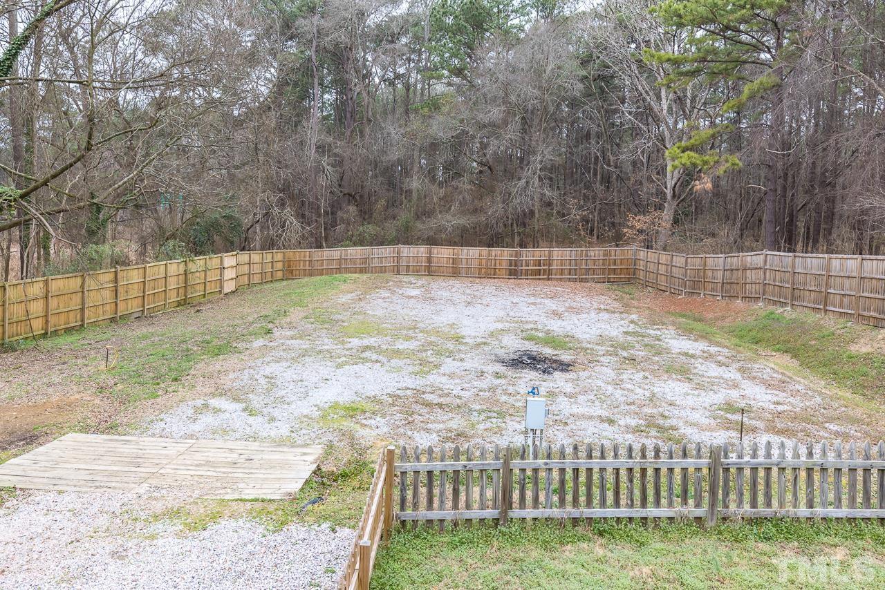 1314 Dowling Road Raleigh, NC 27610 - Photo 23 of 34 a view of a backyard with large trees