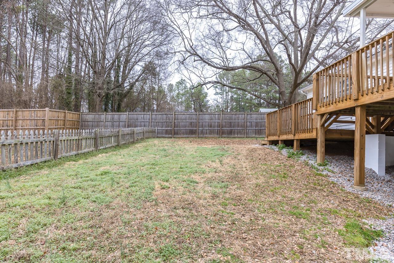 1314 Dowling Road Raleigh, NC 27610 - Photo 24 of 34 a view of a backyard with a small cabin