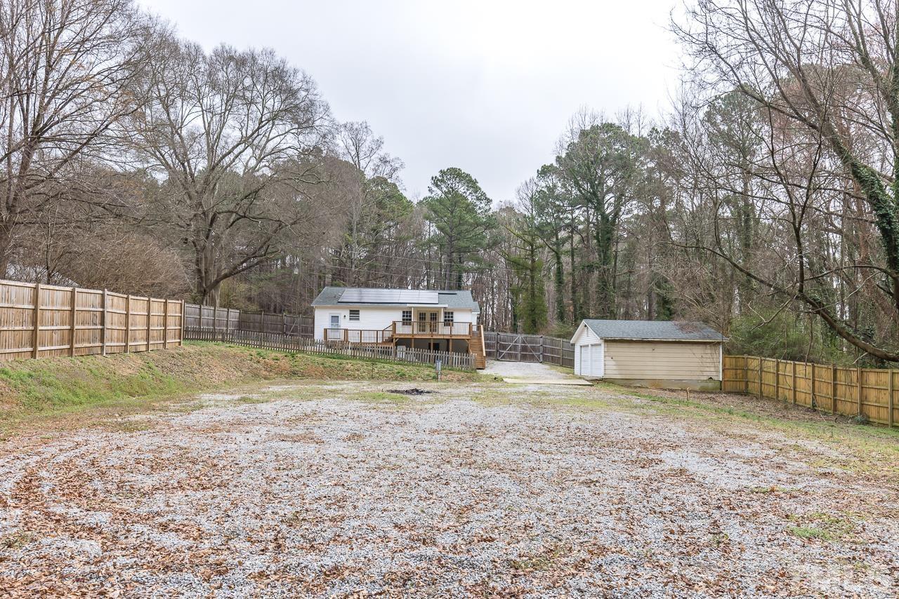 1314 Dowling Road Raleigh, NC 27610 - Photo 30 of 34 a view of a house with backyard and trees