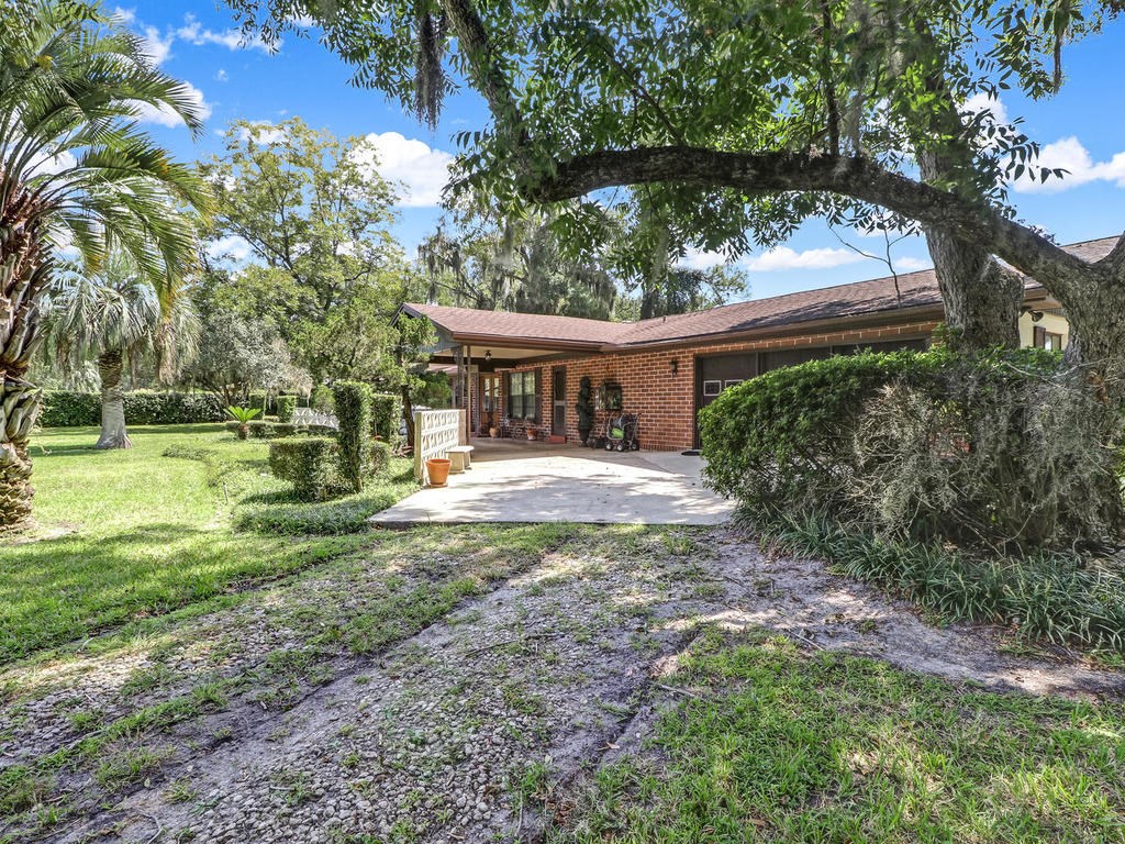 542233 Lem Turner Road Callahan, FL 32011 - Photo 13 of 31 a view of a house with a yard