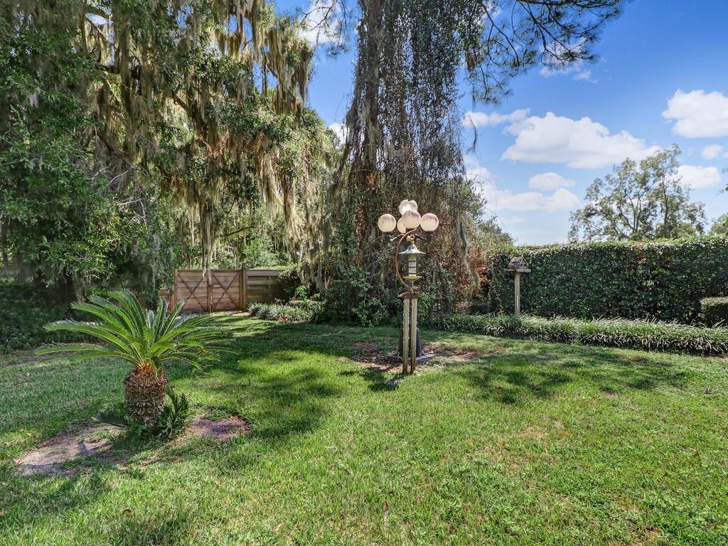 542233 Lem Turner Road Callahan, FL 32011 - Photo 23 of 31 a backyard of a house with lots of green space