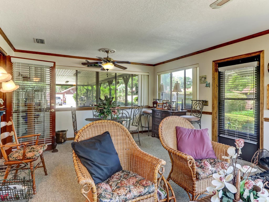 542233 Lem Turner Road Callahan, FL 32011 - Photo 24 of 31 a living room with furniture and large windows