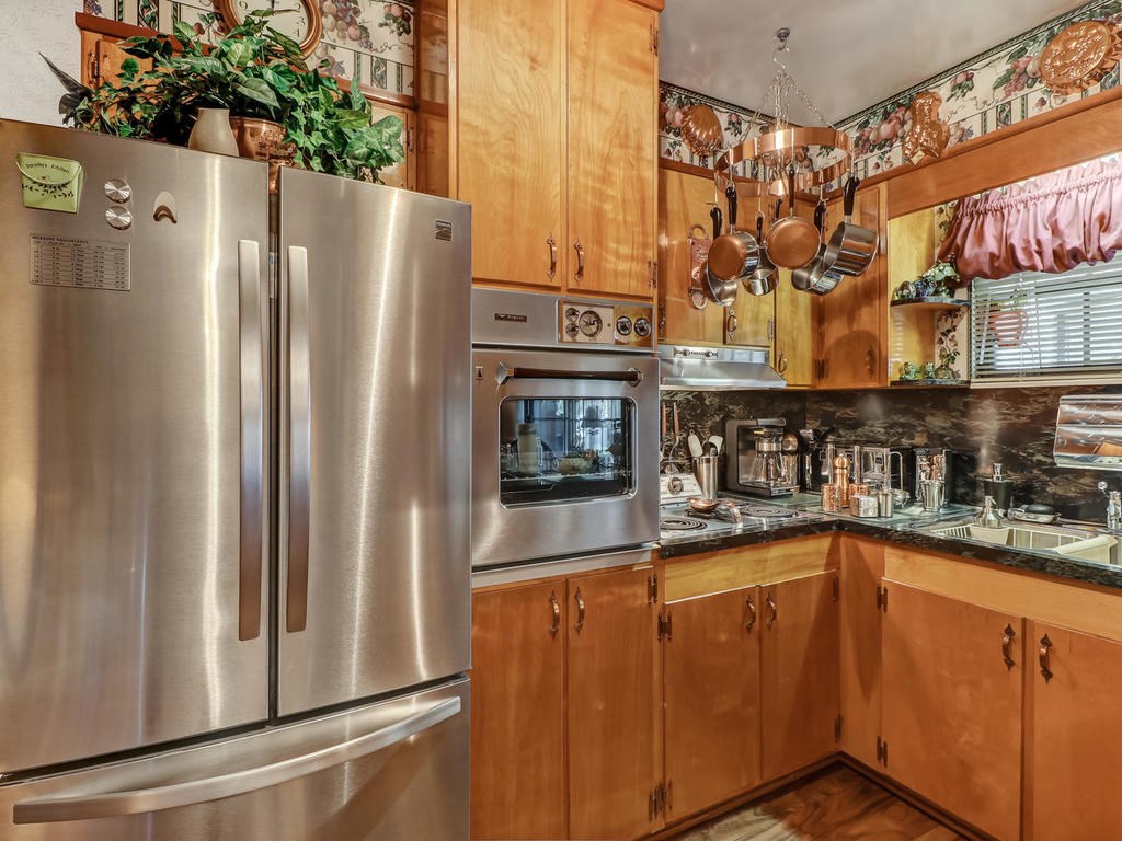 542233 Lem Turner Road Callahan, FL 32011 - Photo 3 of 31 a kitchen with stainless steel appliances granite countertop a refrigerator and a sink