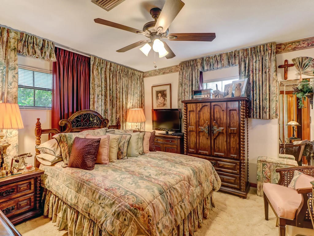 542233 Lem Turner Road Callahan, FL 32011 - Photo 5 of 31 a bedroom with a bed next to a window and a flat screen tv