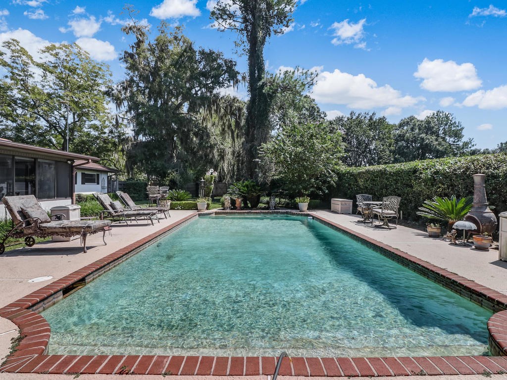 542233 Lem Turner Road Callahan, FL 32011 - Photo 10 of 31 a view of a swimming pool with a patio