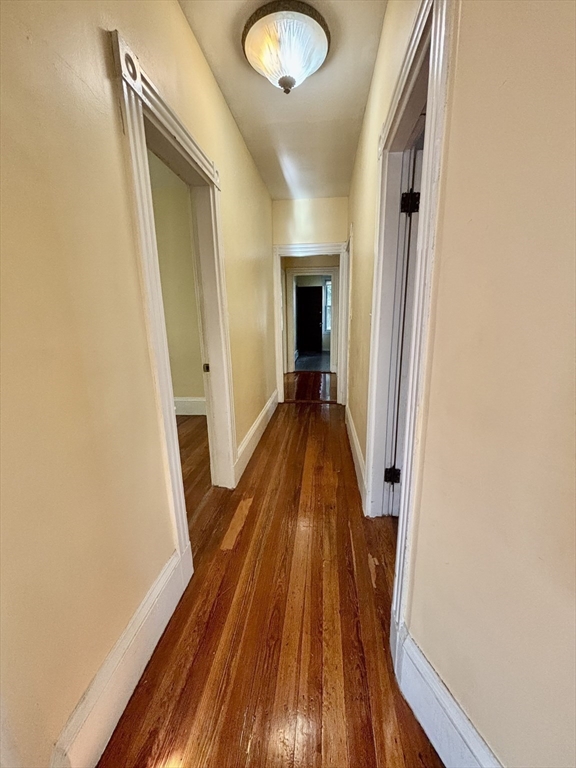 11 Raven Street, Unit 2 Boston, MA 02125 - Photo 3 of 10 a view of a hallway with wooden floor and staircase