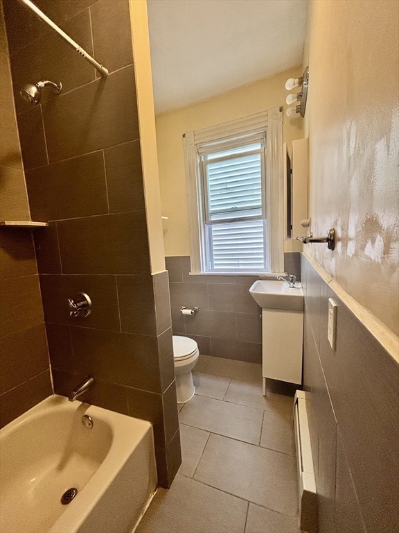 11 Raven Street, Unit 2 Boston, MA 02125 - Photo 5 of 10 a bathroom with a sink a toilet and tub