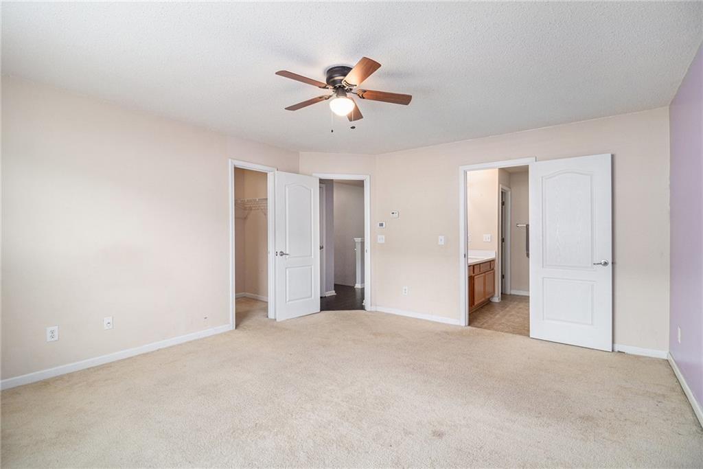 3262 Cascade Parc Boulevard Southwest Atlanta, GA 30311 - Photo 13 of 24 a view of a livingroom with a ceiling fan and window