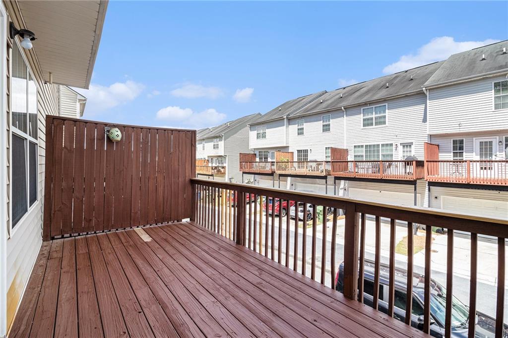 3262 Cascade Parc Boulevard Southwest Atlanta, GA 30311 - Photo 19 of 24 a view of a balcony with wooden floor