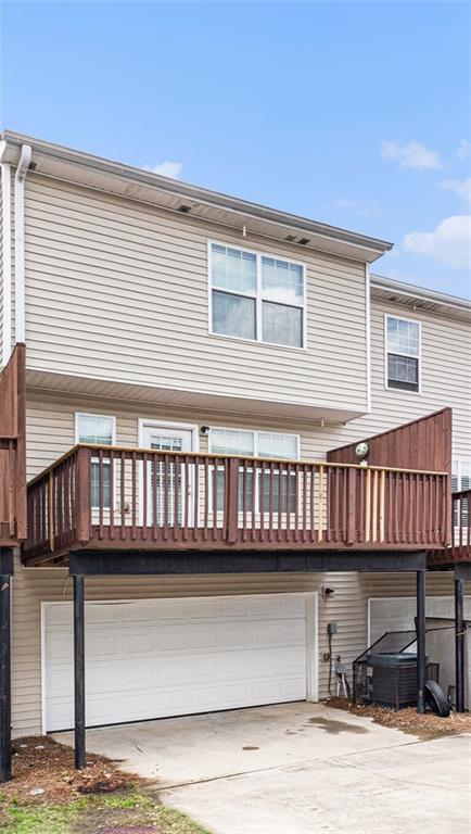 3262 Cascade Parc Boulevard Southwest Atlanta, GA 30311 - Photo 20 of 24 a view of a house with a wooden deck
