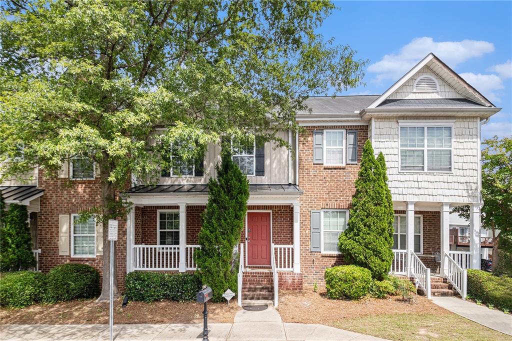 3262 Cascade Parc Boulevard Southwest Atlanta, GA 30311 - Photo 2 of 24 a front view of a house with a yard