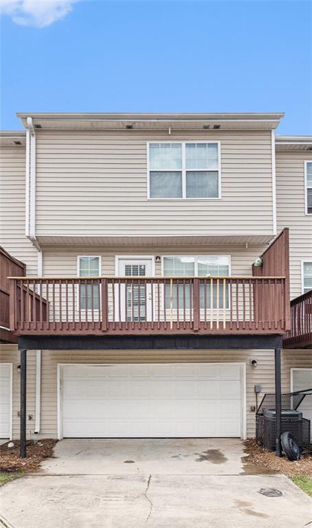 3262 Cascade Parc Boulevard Southwest Atlanta, GA 30311 - Photo 21 of 24 a front view of a house with glass windows