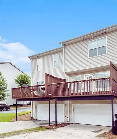 a view of a patio with a table and chairs