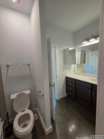 a bathroom with a shower and toilet