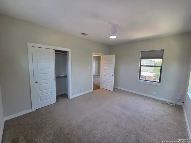 a view of hallway with wooden floor