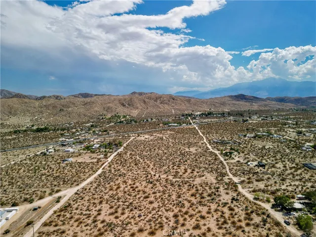 an aerial view of residential house and covered with snow
