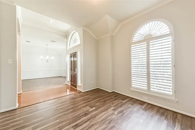 a bathroom with a shower and a glass door