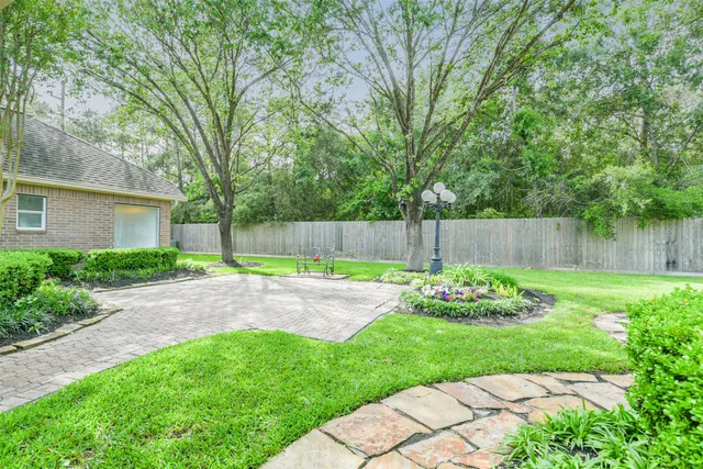 a view of empty room with wooden floor and ceiling fan
