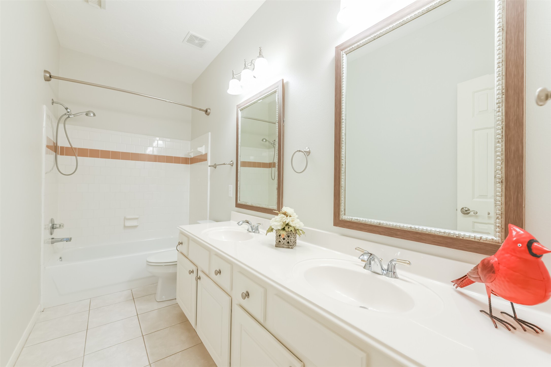 14610 Farrawood Drive Cypress, TX 77429 - Photo 29 of 35 a bathroom with a double vanity sink mirror double and shower