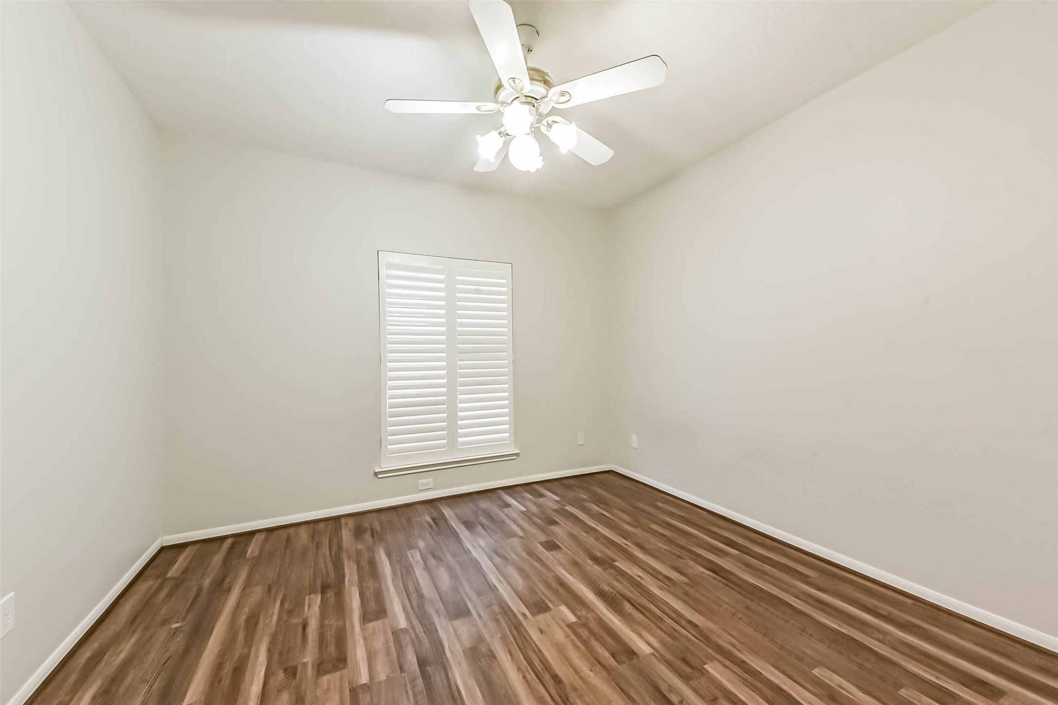 14610 Farrawood Drive Cypress, TX 77429 - Photo 30 of 35 wooden floor in an empty room with a window