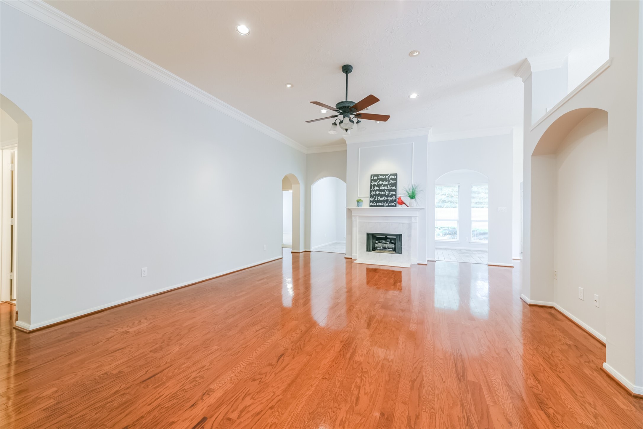 14610 Farrawood Drive Cypress, TX 77429 - Photo 3 of 35 a view of empty room with wooden floor and ceiling fan