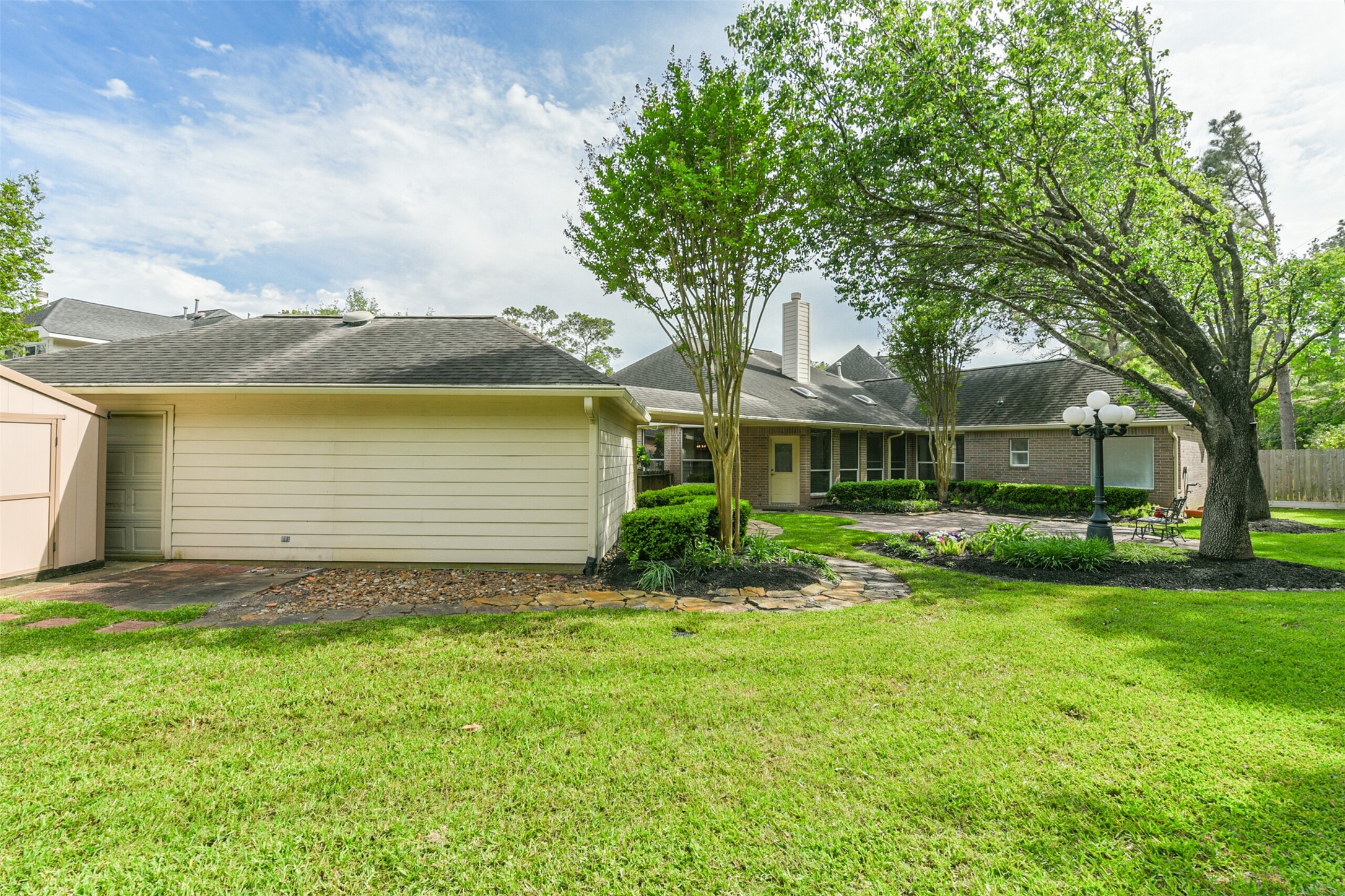 14610 Farrawood Drive Cypress, TX 77429 - Photo 34 of 35 a view of a house with a garden