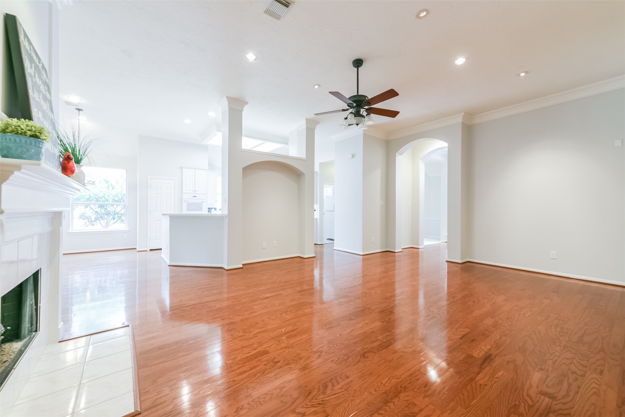 14610 Farrawood Drive Cypress, TX 77429 - Photo 5 of 35 a view of an empty room with wooden floor and a ceiling fan