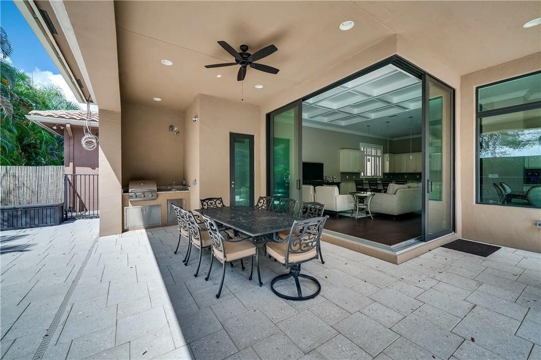 17888 Key Vista Way Boca Raton, FL 33496 - Photo 40 of 50 Backyard dining Full open sliding doors