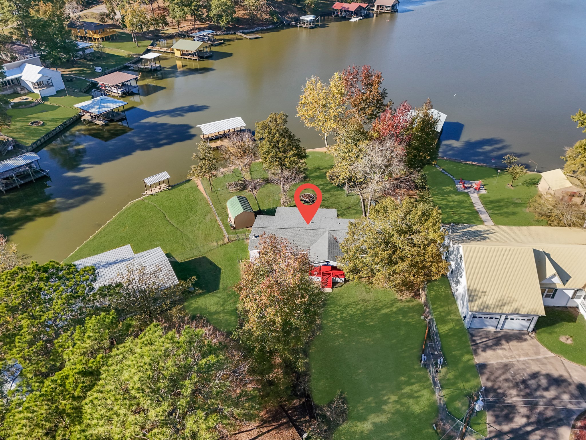 an aerial view of a houses with swimming pool