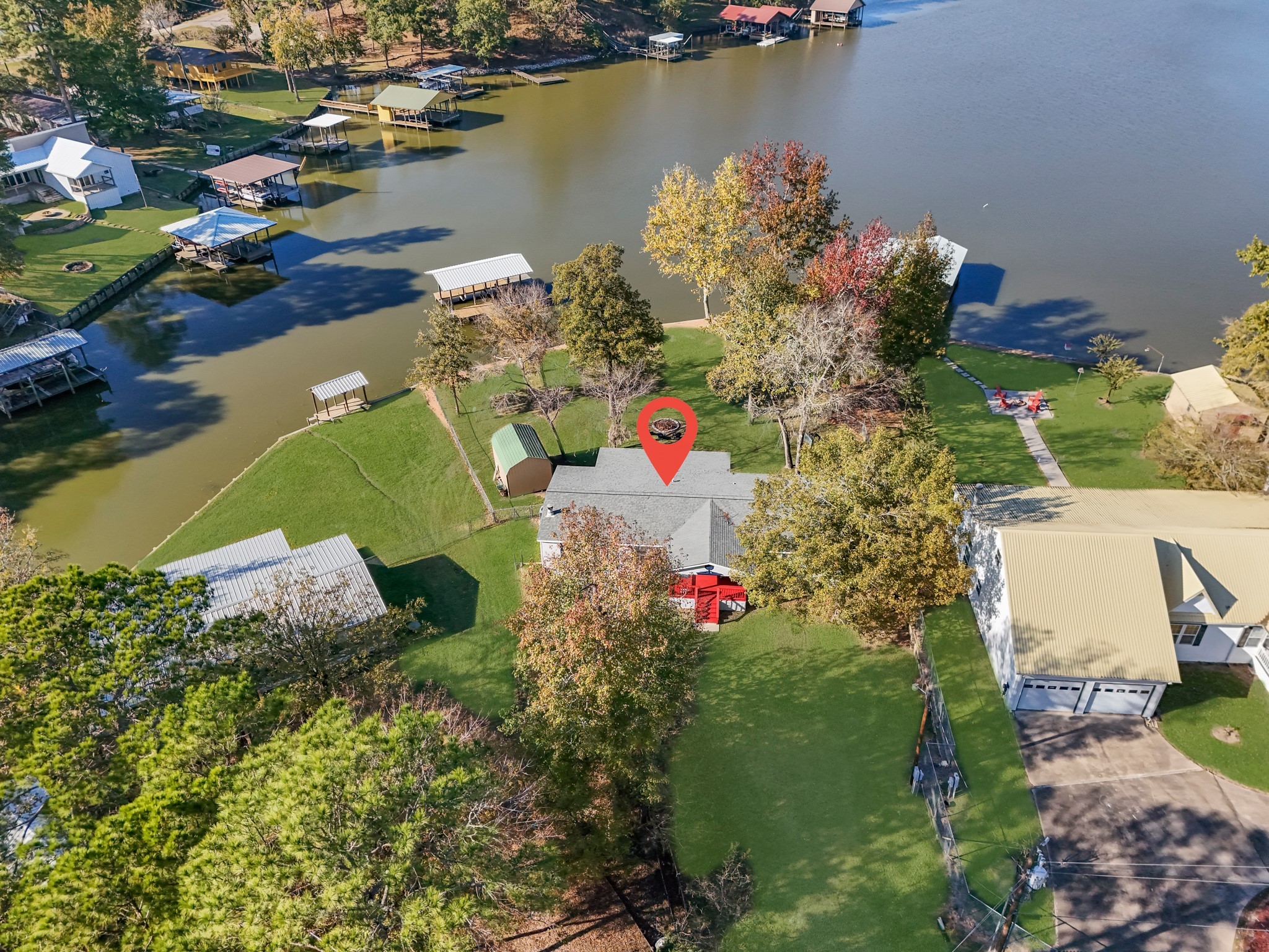 an aerial view of a houses with swimming pool