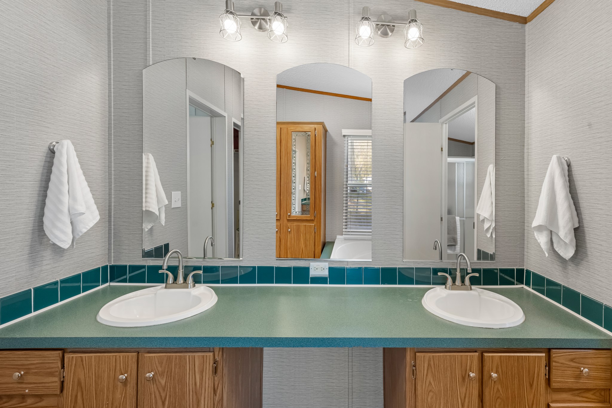 450 Ridge Trail Trinity, TX 75862 - Photo 14 of 30 a bathroom with a sink and a mirror