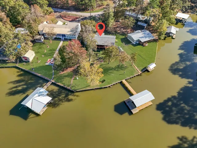 an aerial view of a house with a ocean view