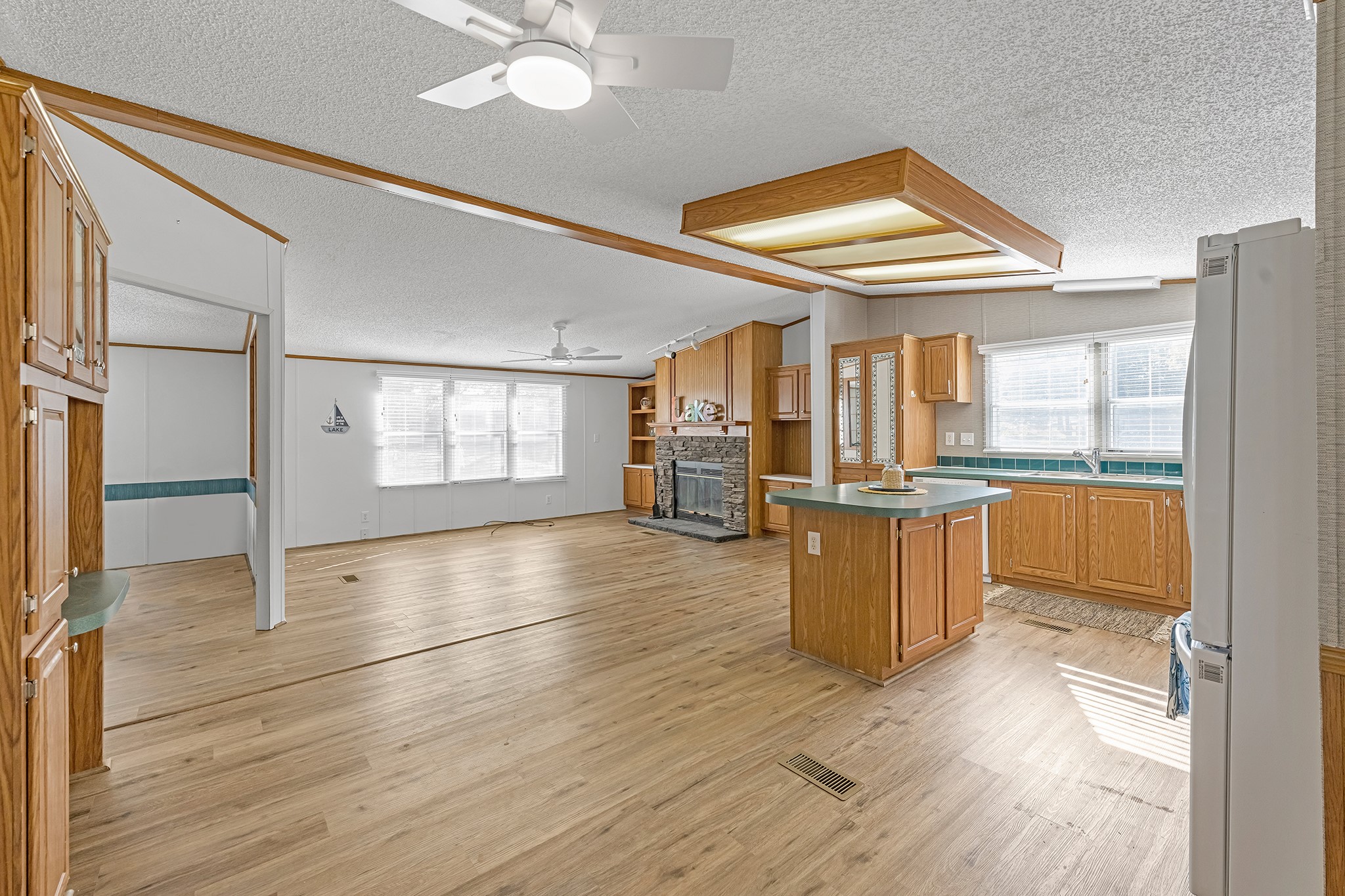 450 Ridge Trail Trinity, TX 75862 - Photo 8 of 30 an empty room with wooden floor and windows
