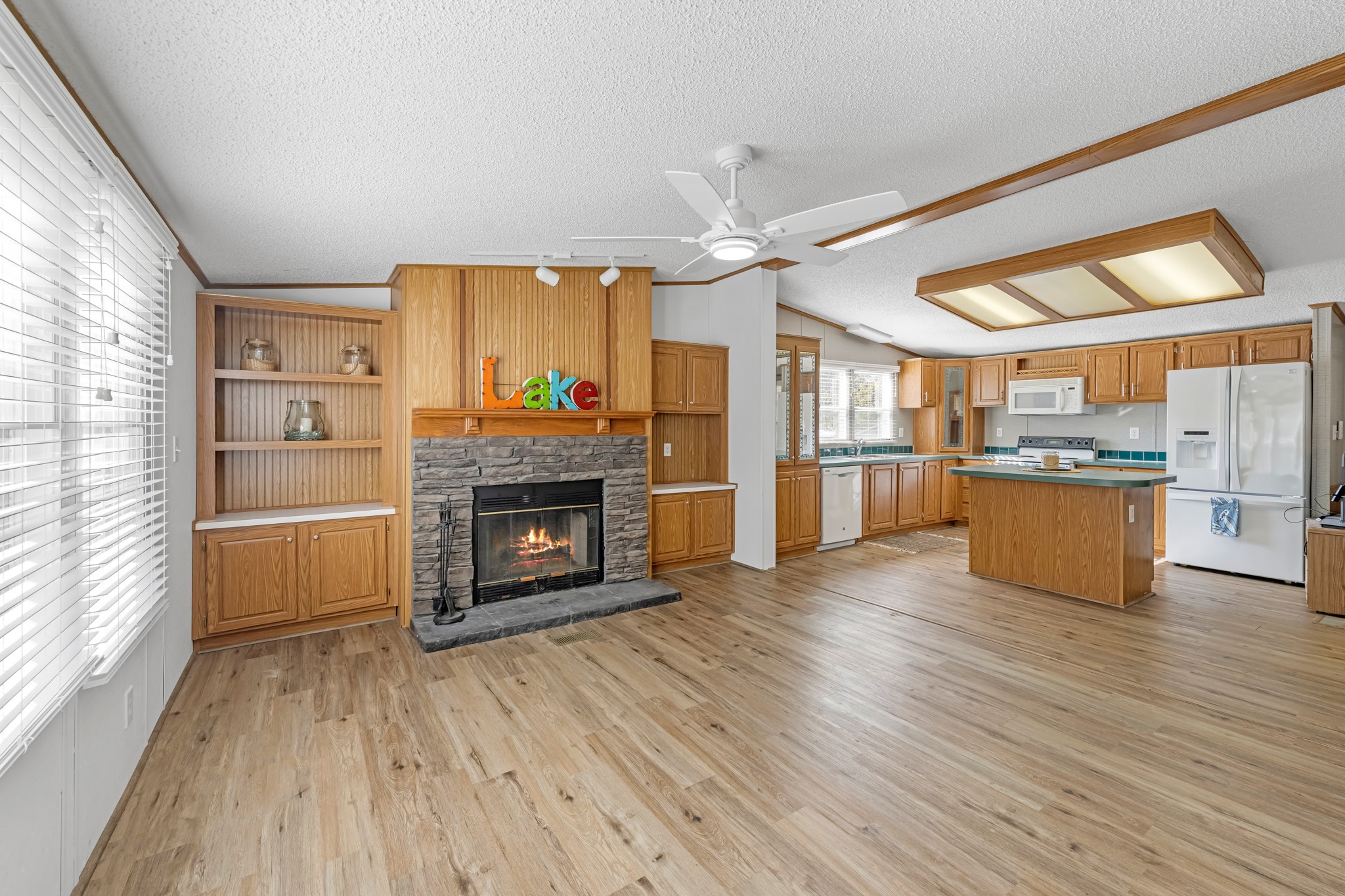 450 Ridge Trail Trinity, TX 75862 - Photo 10 of 30 a large kitchen with cabinets wooden floor and stainless steel appliances