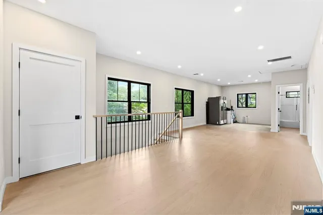 a view of a livingroom with furniture and a ceiling fan