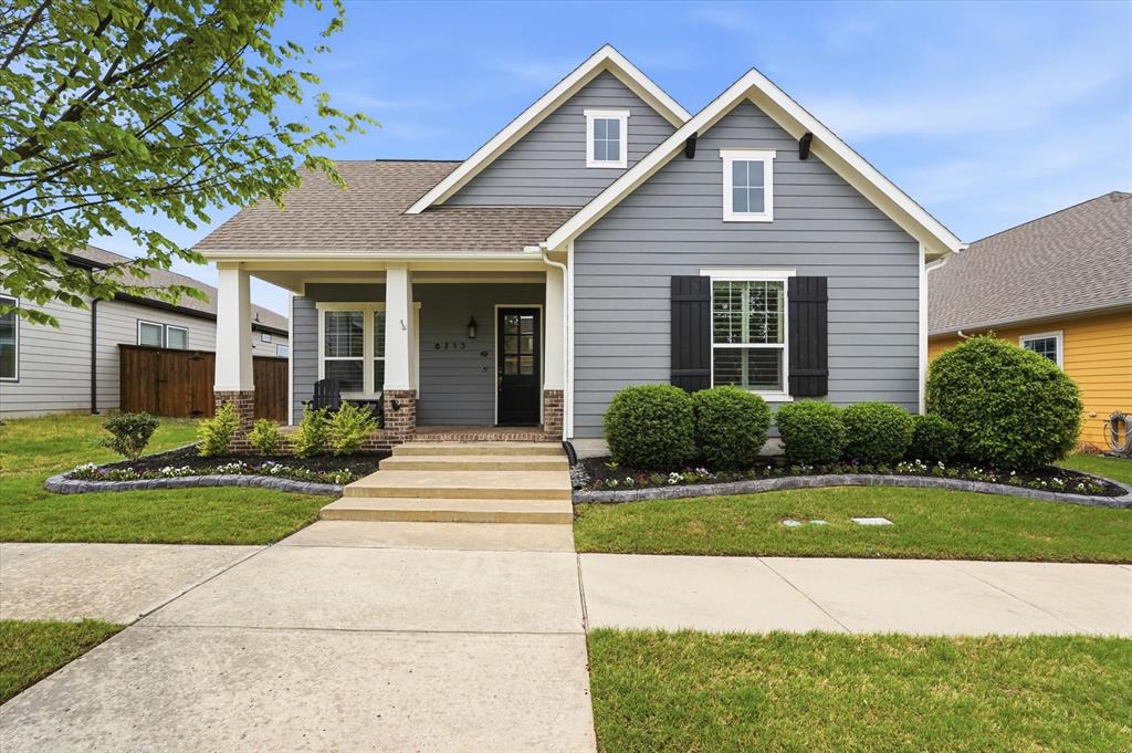 a view of house with yard and green space