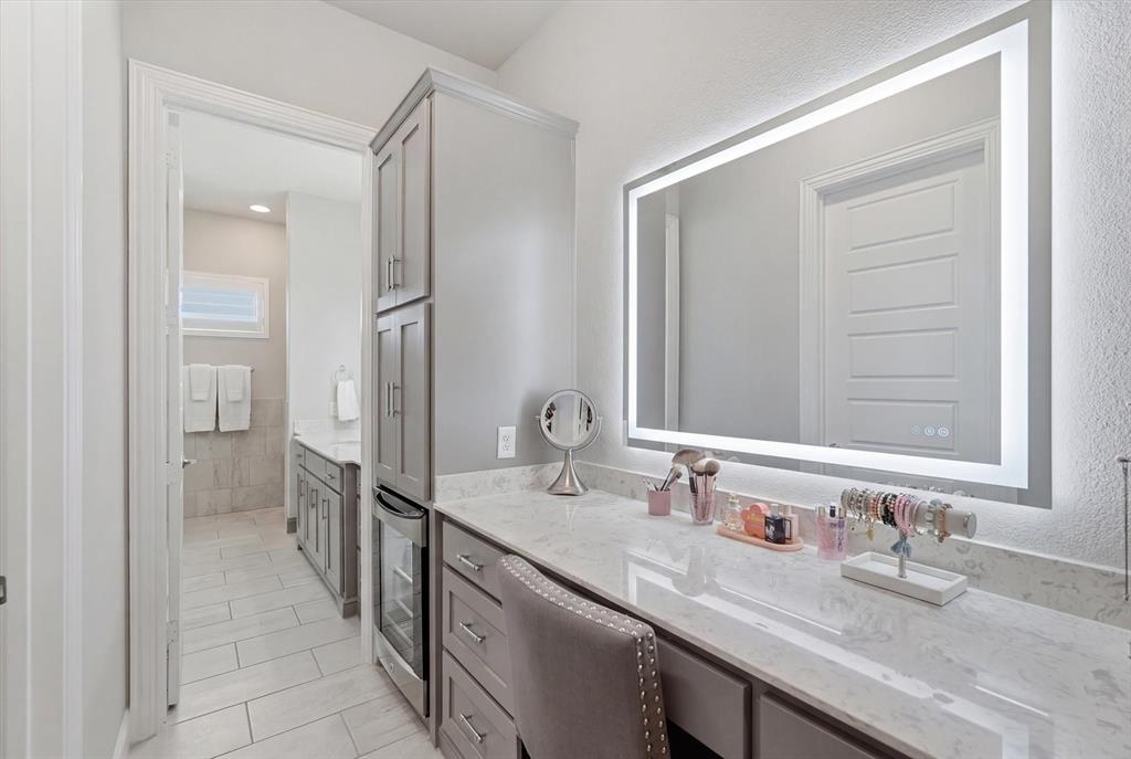 8713 Homestead Boulevard Rowlett, TX 75089 - Photo 11 of 28 a bathroom with a granite countertop sink and a mirror