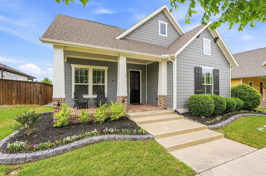 8713 Homestead Boulevard Rowlett, TX 75089 - Photo 2 of 28 a front view of a house with garden