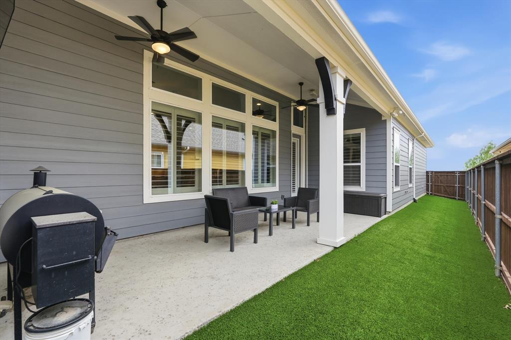 8713 Homestead Boulevard Rowlett, TX 75089 - Photo 21 of 28 a front view of a house with a garden and patio