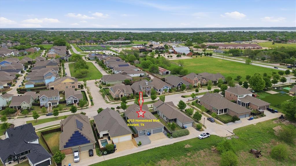 8713 Homestead Boulevard Rowlett, TX 75089 - Photo 23 of 28 an aerial view of residential houses with outdoor space