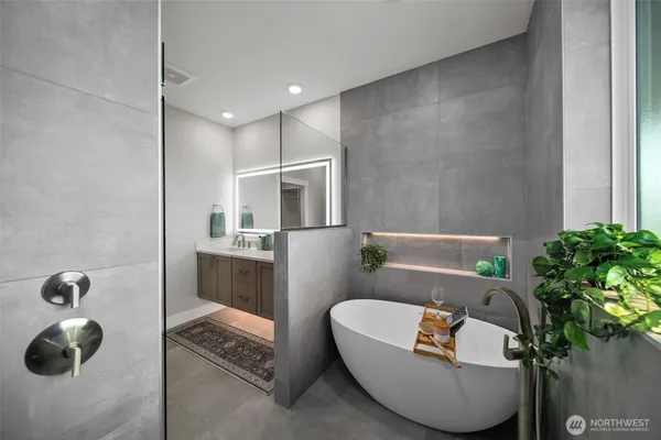 a bathroom with a tub and sink